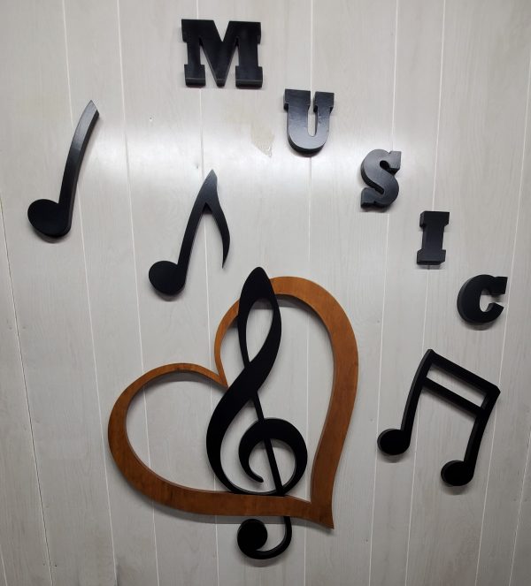 Music lover stained heart with black clef mark along with music notes and the work music.